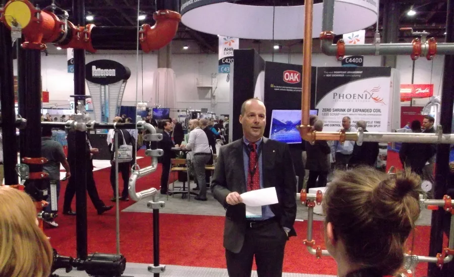 Rick Bucher, Victaulic’s evp of technology and product development, gives the eager trade press a rundown of the company’s new products and initiatives