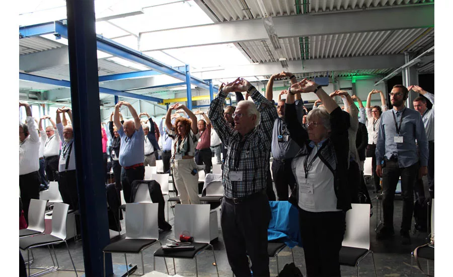 Egger shows attendees an excerize to increase oxygen to the brain