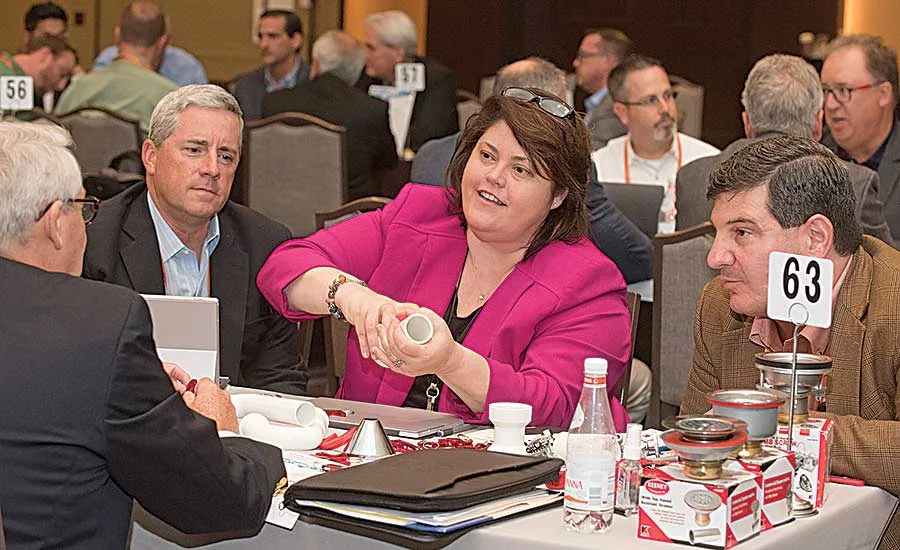 Keeney Mfg. Co.’s Karen Fox talks to a customer