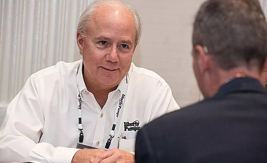 Liberty Pumps’ Chuck Schwabe talks to a customer during the vendor-wholesaler appointments in New York City
