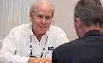 Liberty Pumps’ Chuck Schwabe talks to a customer during the vendor-wholesaler appointments in New York City