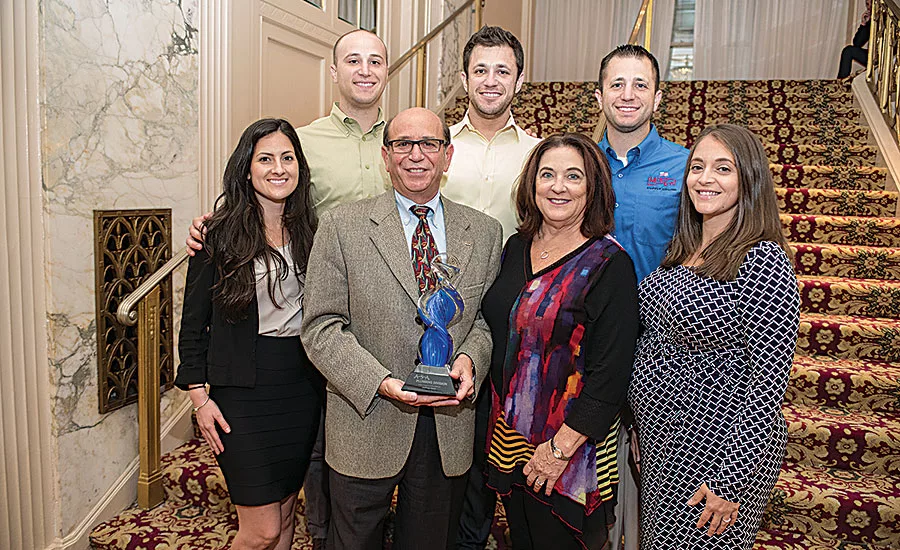 Mid-City Supply’s Jeff New (front row, second from left) with his family after being named the recipient of the 2016 ASA Plumbing Division Award of Excellence. Photo by Bob Levy and Courtesy of ASA