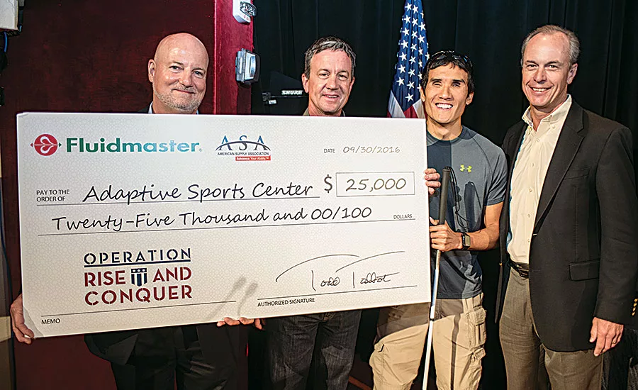 Fluidmaster presents a check for $25,000 to Operation Rise and Conquer during NETWORK2016