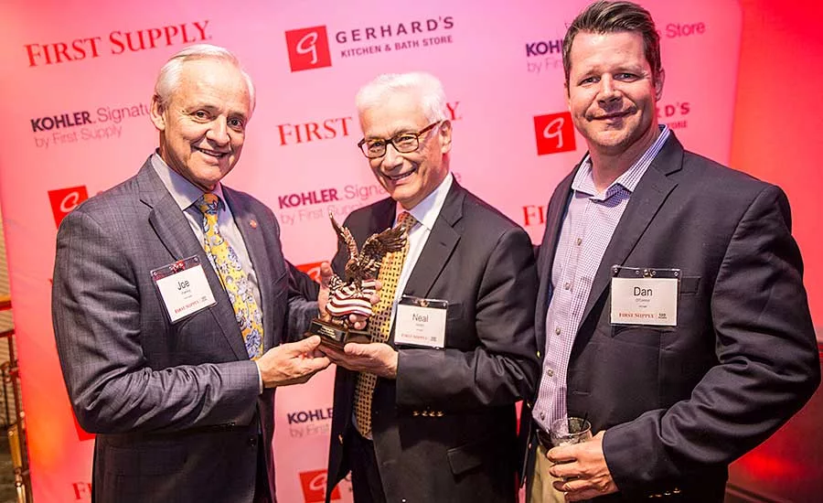 First Supply’s Joe Poehling (left) with an award