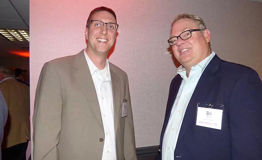 Bongard Corp.’s Mark Mayer (left) with Mansfield Plumbing’s Bill Halsted