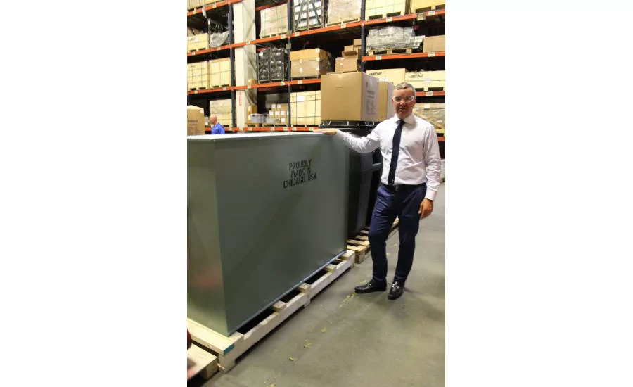 President Michael Whiteside with a large grease interceptor