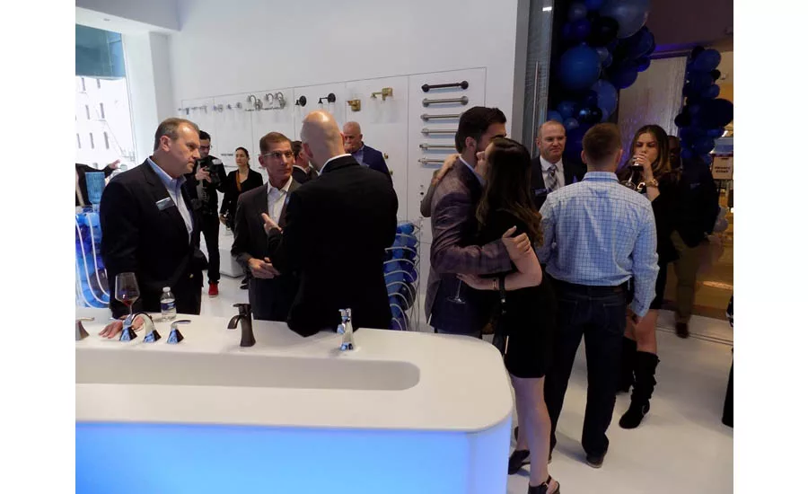 Industry folks meet and greet at the Moen grand opening event