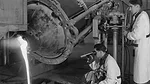 A. O. Smith engineers smelt mixed ingredients into a liquid mass under 2,000 degree (F) heat.