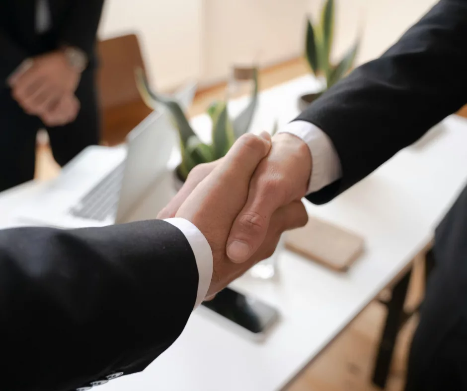 Two people shaking hands.