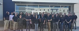 The mSupply team in front of its newest distribution center. 