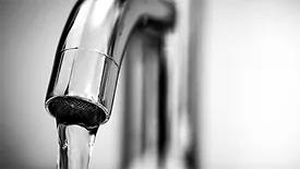 Water flowing from a faucet. 