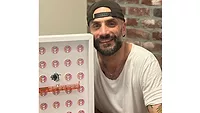 Regis Saragosti, former Saniflo U.S.A. CEO, posing with his art. 