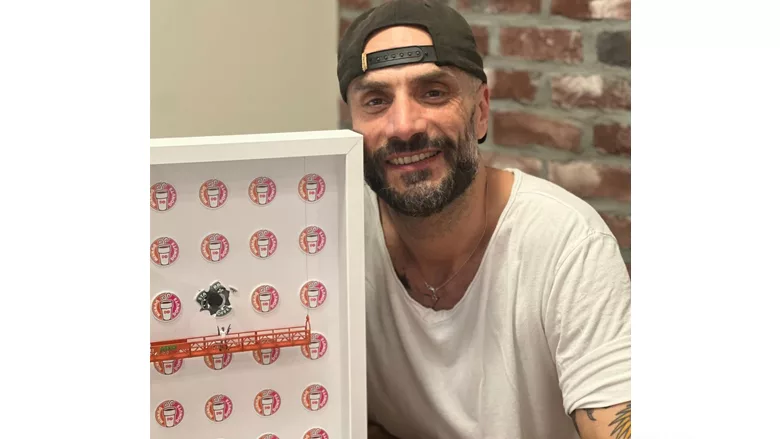 Regis Saragosti, former Saniflo U.S.A. CEO, posing with his art. 