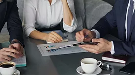 Several people attending a business meeting.