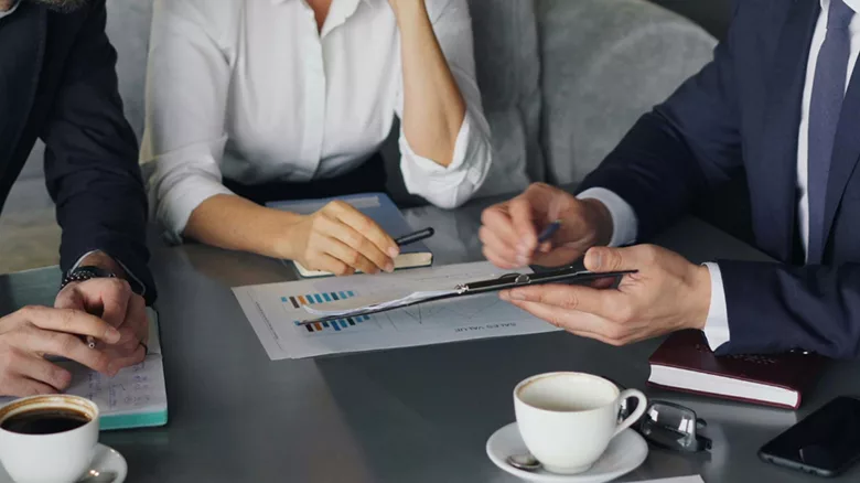 Several people attending a business meeting.