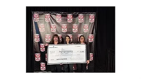 The Bradford White team posing with a check made out to Philabundance. 