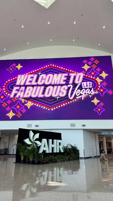 Welcome to Fabulous Las Vegas marquee in shades of purple above the AHR sign.