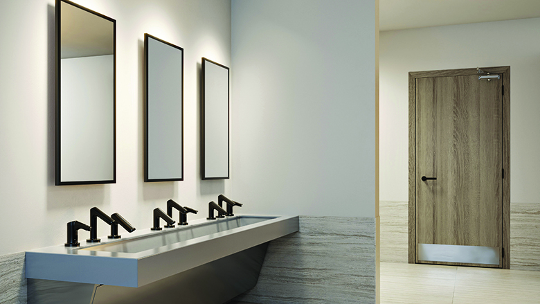 A restroom with Sloan accessories. 