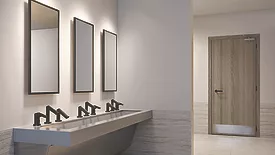 A restroom with Sloan accessories. 