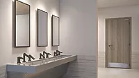 A restroom with Sloan accessories. 