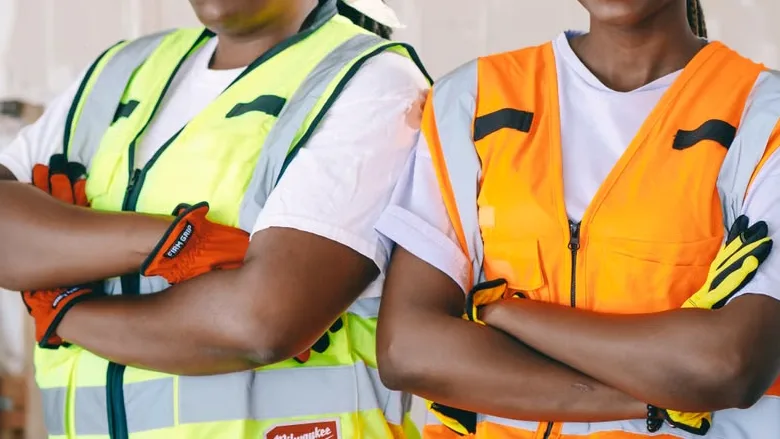 Two contractors with crossed arms.