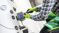 Large Residential Water Heating Boiler Maintenance Performed by Professional HVAC Technician Large Residential Water Heating Boiler Maintenance Performed by Professional HVAC Technician