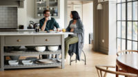 couple sitting in kitchen