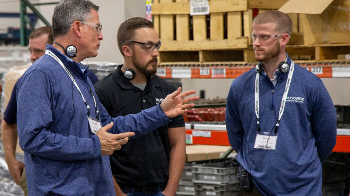 Scott Cooper (left) and Gary Archambault (right) giving a Liberty Pumps Factory tour