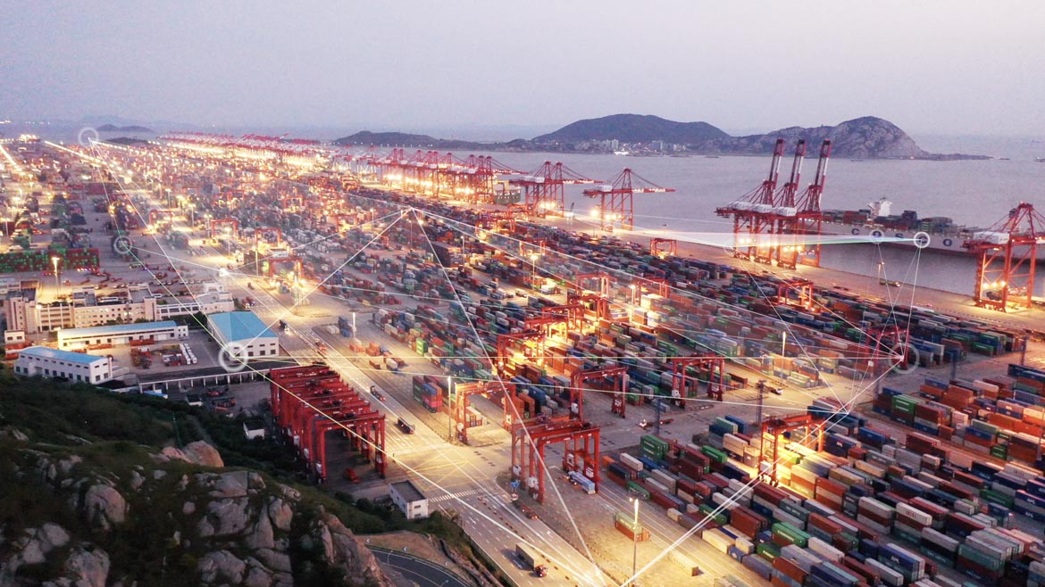 2024 PHCP-PVF Industry Forecast feature. Night scene of container terminal by water.