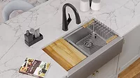 KBIS Product Preview: Elkay workstation sink on marble countertop in kitchen.