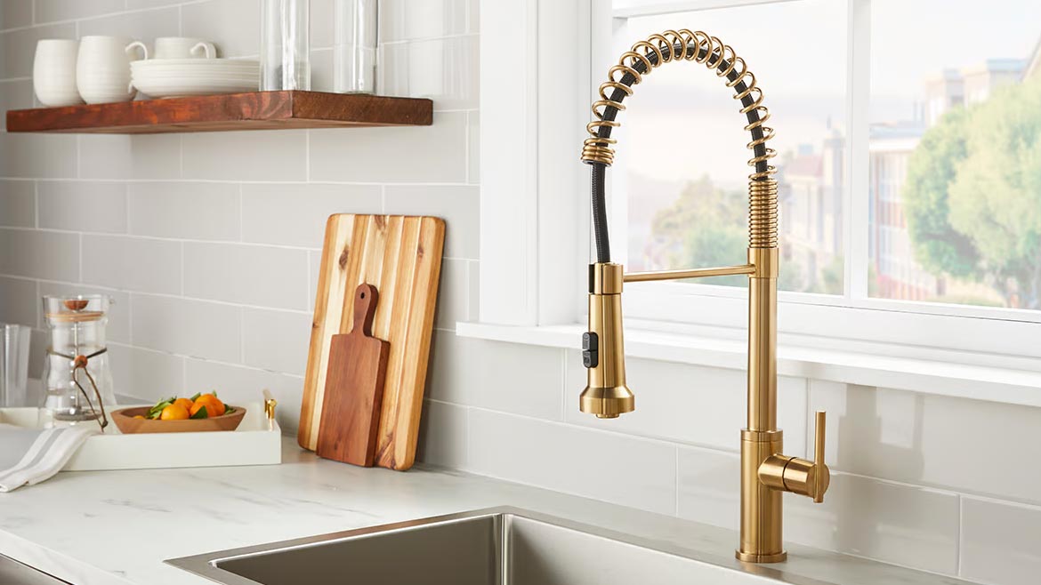 Supply House Times 2023 Products of the Year #6 Gerber Parma Pre-Rinse Single Handle Spring Pull-Down Kitchen Faucet in gold