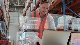SHT February Digitization vs. Amazon feature image of worker on laptop surrounded by virtual screens.
