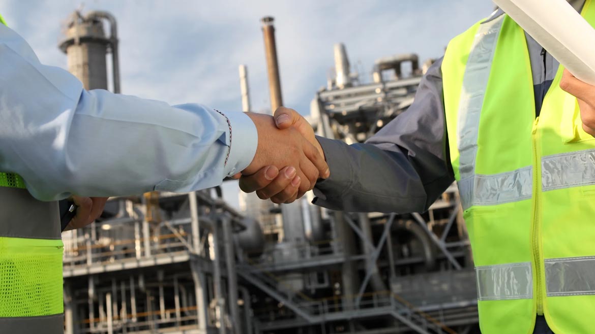 Industrial Distribution feature image of two men shaking hands