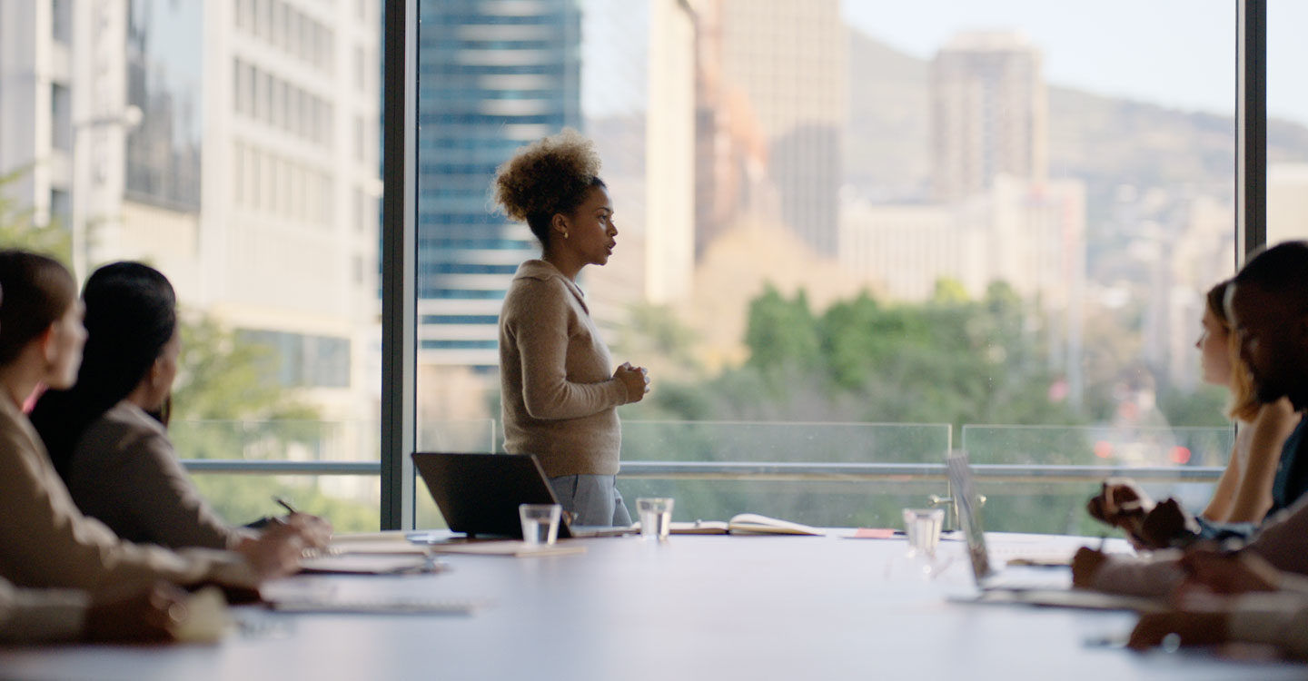 Meet 10 Influential PHCP-PVF Women: Woman leading a meeting in a boardroom