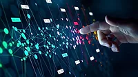Hand pointing to digital bubble chart
