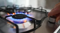 Close up of gas stove burner being turned on.