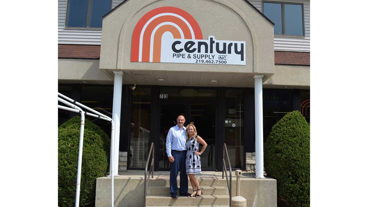 Dave and Carol in front of Century Supply