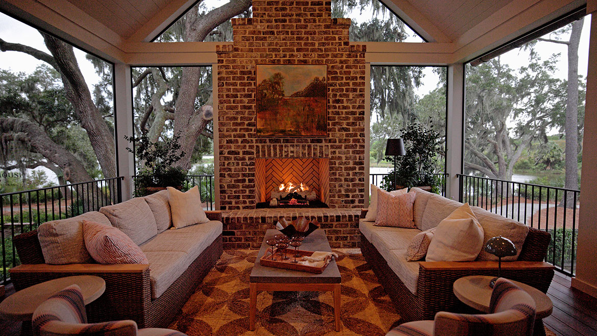 Exterior fireplace in a covered porch.