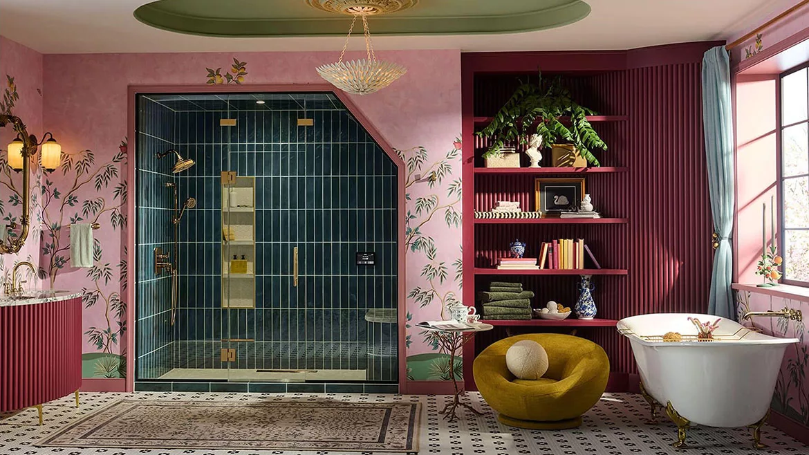 Brizo Booth at KBIS 2025 featuring a pink bathroom with with blue-tiled walk-in shower.