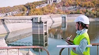 A female engineer working in a hydroelectric power station.
