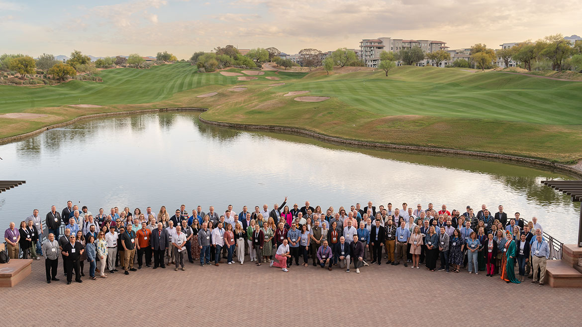 Group photo of the entire LPG group by a pond outside at the Westin Kierland Resort & Spa.