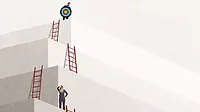 Man Holding Target Looks Down At Woman A woman contemplates rising to the next level of large stone steps - a ladder on each level - as she looks up at a man holding a target and looking down at her.