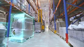 Screenshot from video of a forklift in a modern warehouse.