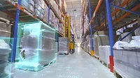 Screenshot from video of a forklift in a modern warehouse.