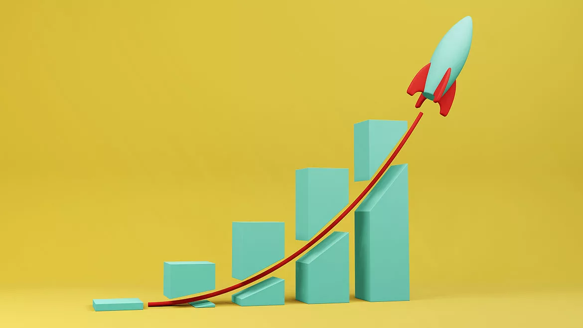 Toy rocket flying through a business bar chart. Illustration of the concept of profitable sale and increasing revenue.