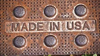 MADE IN USA text sign on rusty worn manufacturing metal