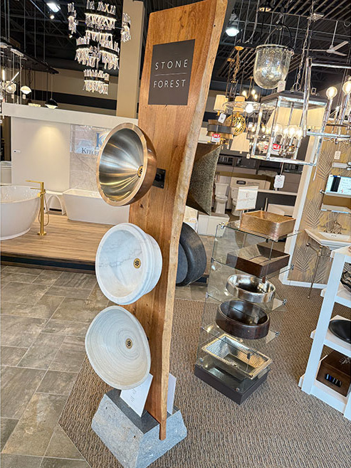 Sinks attached to a wooden display in the Omaha, NE showroom.