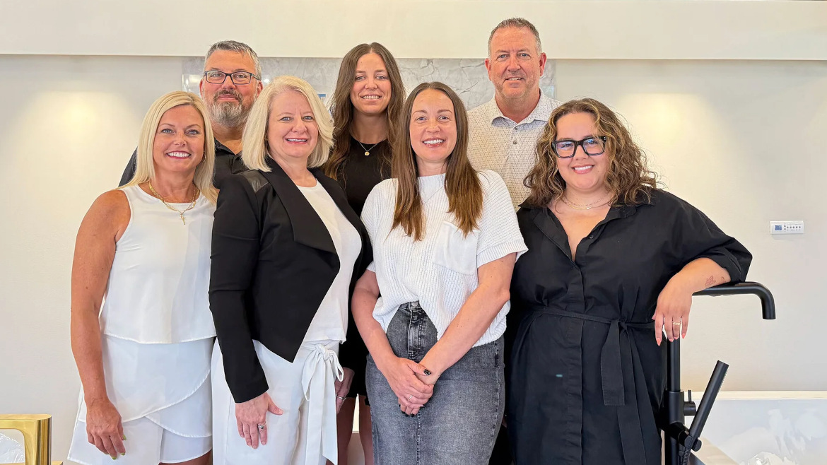 Back row left to right: James Dark, Stephanie Lackovic, and Sean Gardner (President). Front row left to right: Carrie Geihs, Robyn Petersen (Showroom Manager), Jessica Bailey, and Gabrielle Reiss.