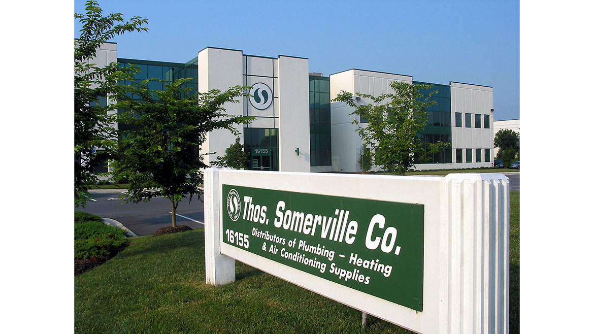 Thos. Somerville Co. headquarters sign with building in the background.