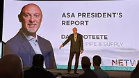 Dave Poteete on stage speaking his final address as ASA President at the NETWORK conference. A large image of him in the background.